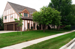 Front yard of a home with beautiful grass in front